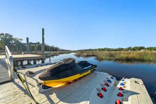 a front view of a house with a garden and yard