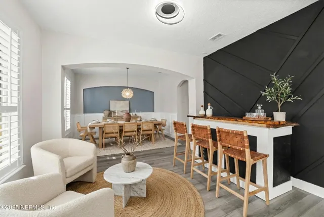 a view of empty room with window and ceiling fan