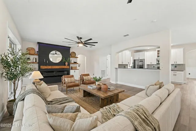 a view of a kitchen with wooden cabinet and a ceiling fan