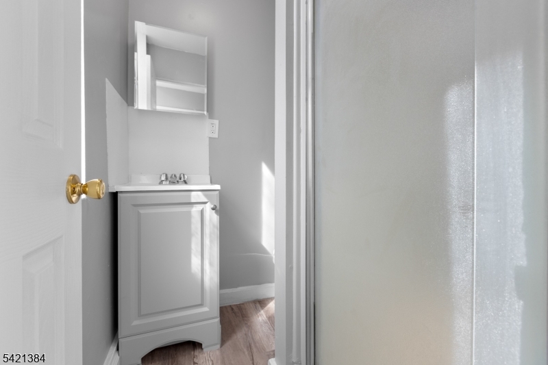 23 Monroe Street, Unit 2 Passaic, NJ 07055 - Photo 12 of 13 a bathroom with a toilet