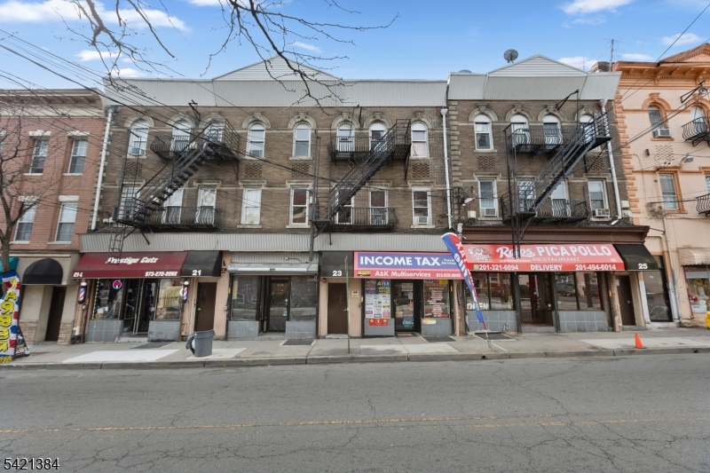 23 Monroe Street, Unit 2 Passaic, NJ 07055 - Photo 13 of 13 a view of a food market with retail shops