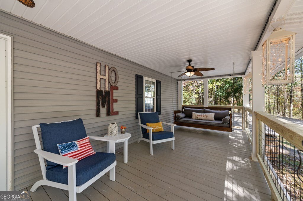 224 Timber Ridge Lane Ellijay, GA 30540 - Photo 16 of 61 a outdoor living space with furniture and a fireplace