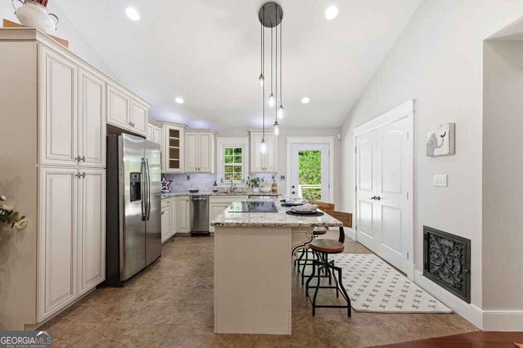 224 Timber Ridge Lane Ellijay, GA 30540 - Photo 29 of 61 a kitchen with refrigerator and cabinets