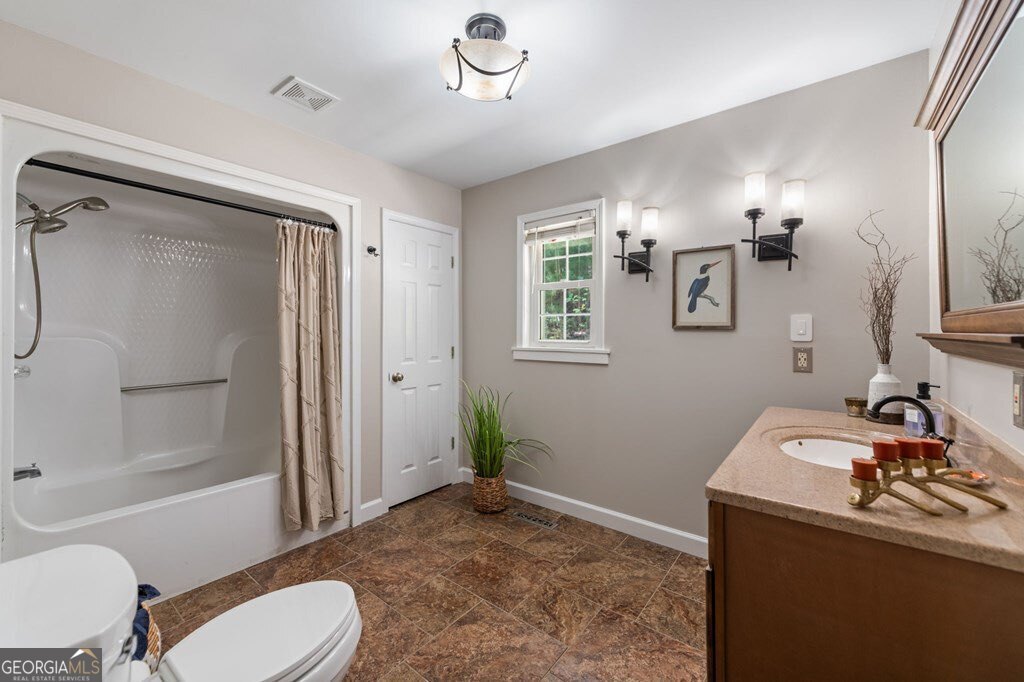 224 Timber Ridge Lane Ellijay, GA 30540 - Photo 39 of 61 a bathroom with a sink toilet and shower