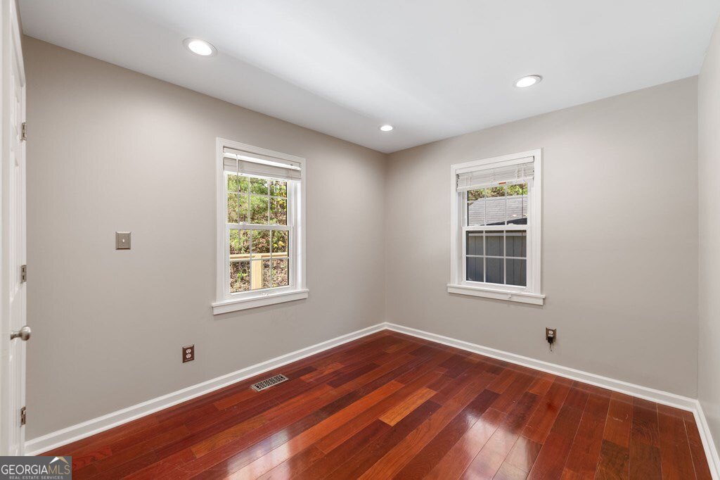 224 Timber Ridge Lane Ellijay, GA 30540 - Photo 42 of 61 an empty room with wooden floor and windows