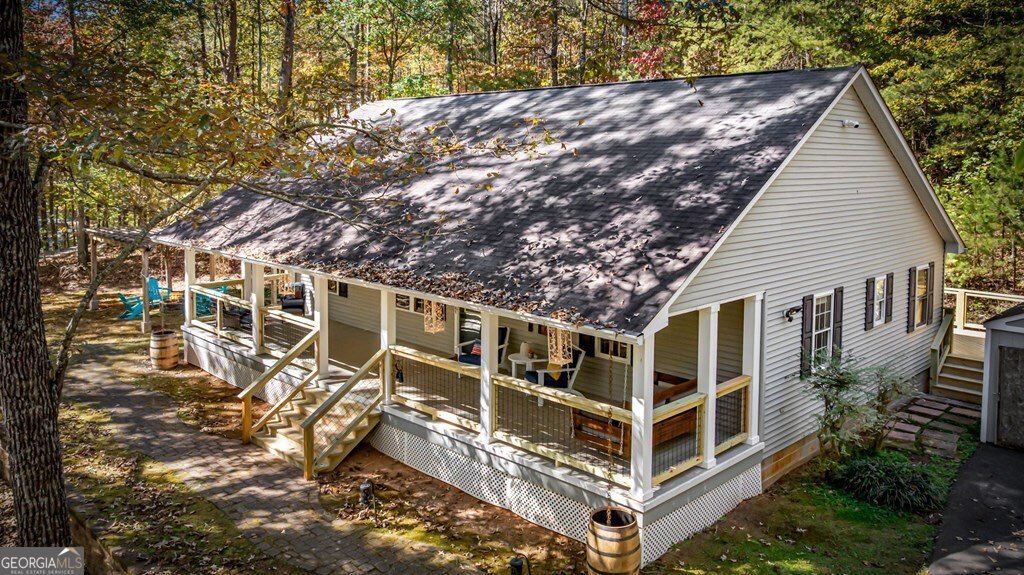224 Timber Ridge Lane Ellijay, GA 30540 - Photo 47 of 61 a view of a large white building with large windows
