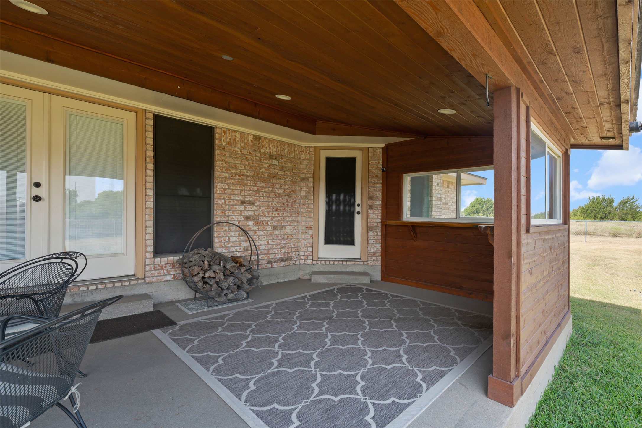 1512 Panther Loop Pflugerville, TX 78660 - Photo 30 of 40 An inviting covered patio offers a comfortable outdoor space with direct access to the interior and expansive backyard.