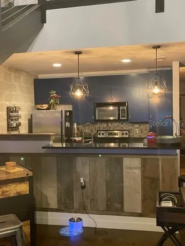 a kitchen with counter top space and cabinets