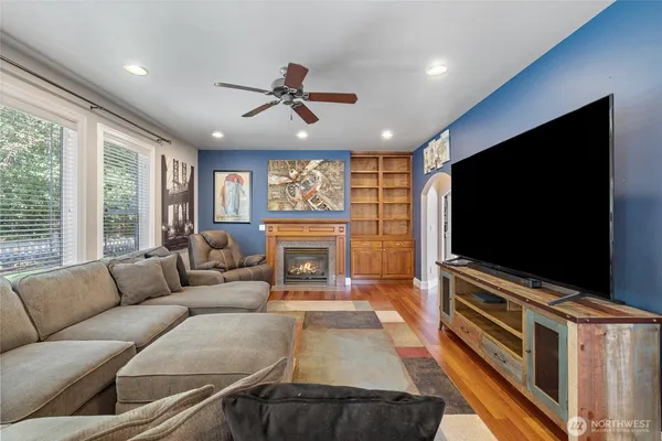 a room with pool table and wall paintings