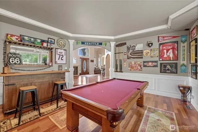 a living room with a flat screen tv and a fireplace