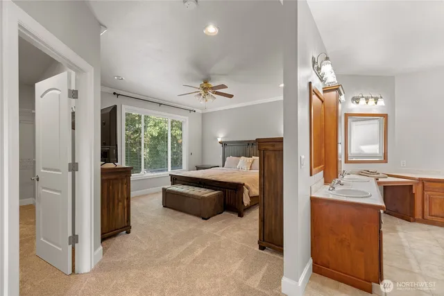 a bedroom with a large bed and a large window