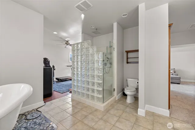 a room with gym equipment and windows