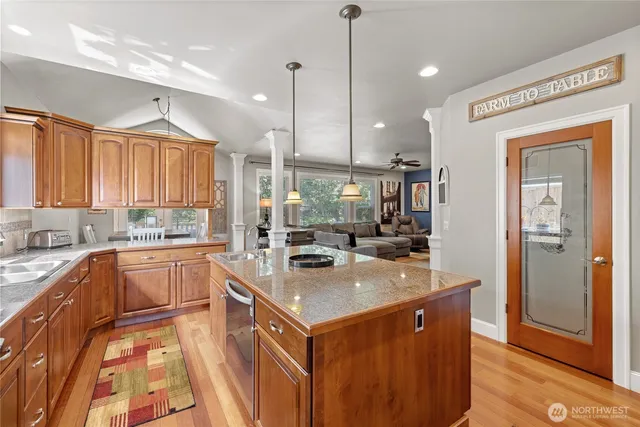 a view of a dining room with furniture and chandelier