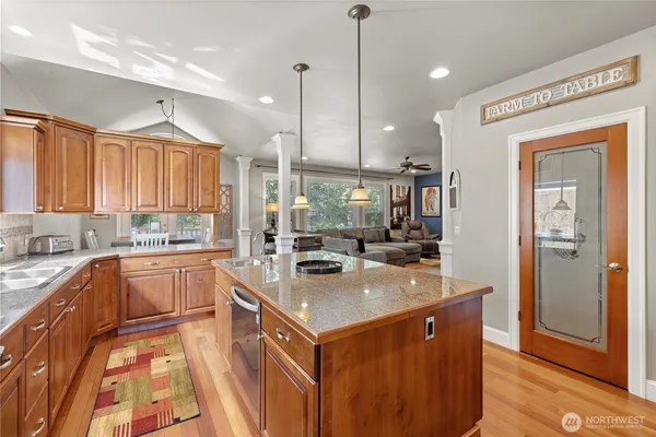 a view of a dining room with furniture and chandelier