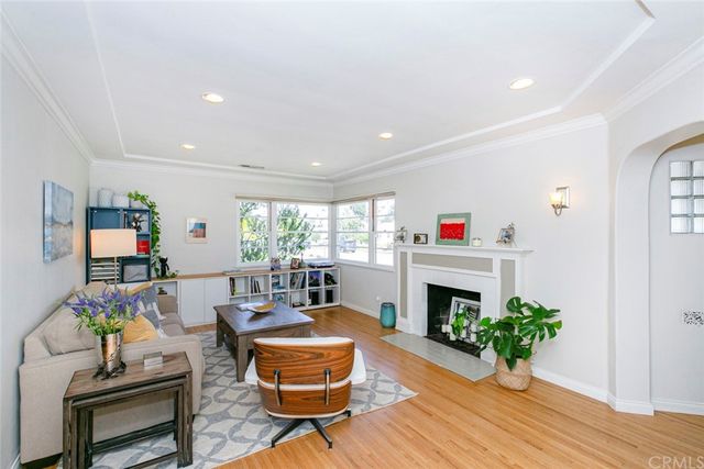 a workspace room with wooden floor table and chair