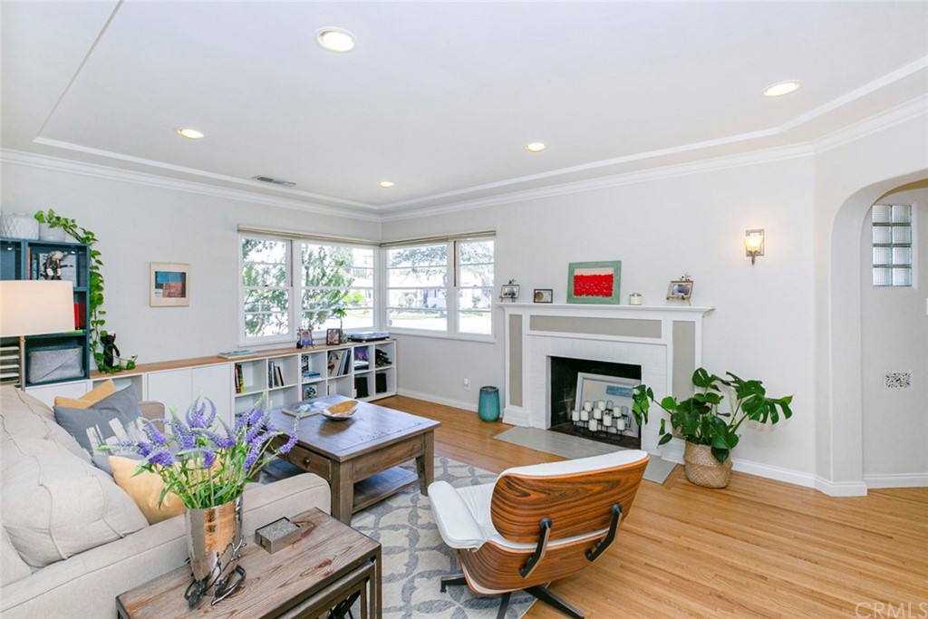 690 Arden Avenue Glendale, CA 91202 - Photo 17 of 70 a living room with furniture a fireplace and a potted plant