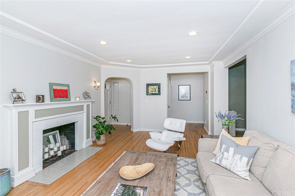 690 Arden Avenue Glendale, CA 91202 - Photo 20 of 70 a living room with furniture a fireplace and a table