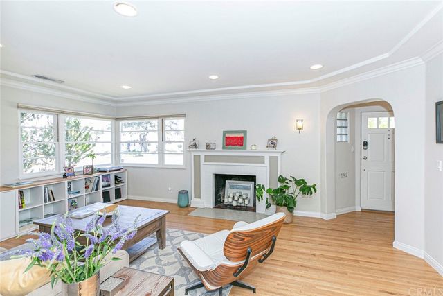 a kitchen with stainless steel appliances a sink a stove and a window