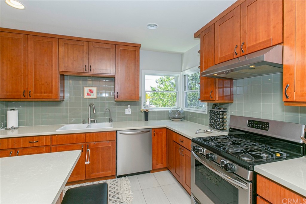 690 Arden Avenue Glendale, CA 91202 - Photo 35 of 70 a kitchen with stainless steel appliances a sink a stove and a window