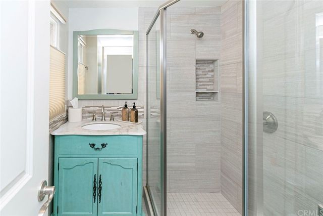 a bed room with a bed and a window