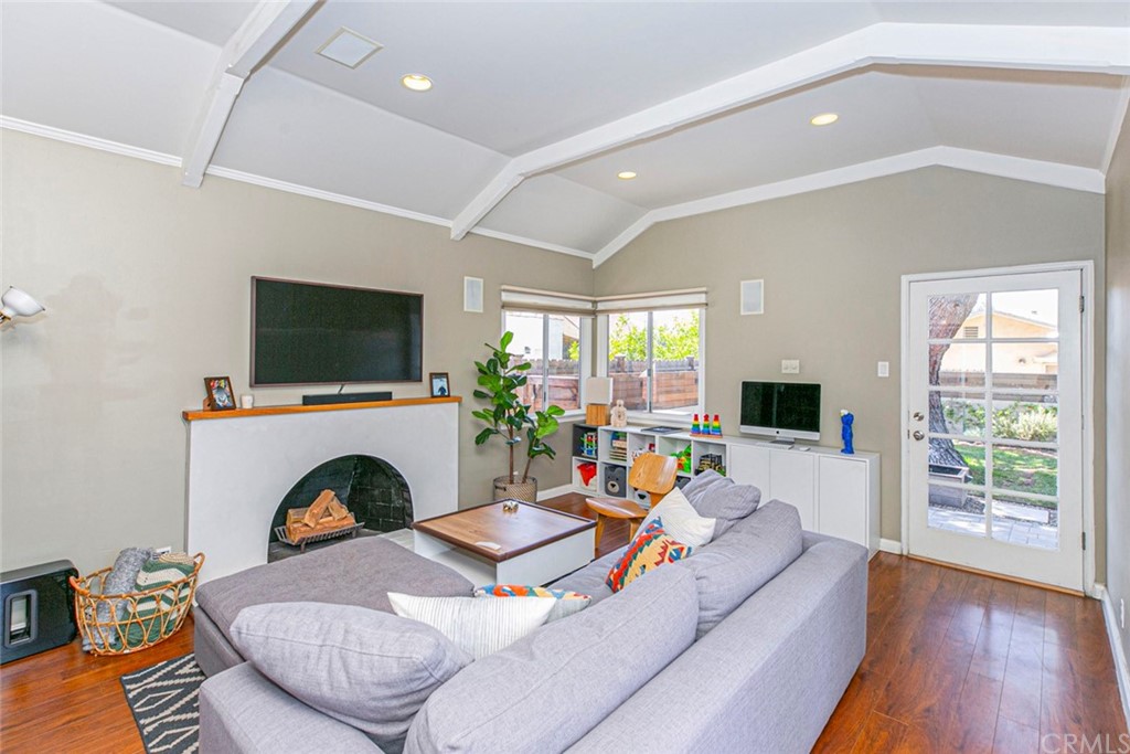 690 Arden Avenue Glendale, CA 91202 - Photo 41 of 70 a living room with furniture a flat screen tv and a fireplace