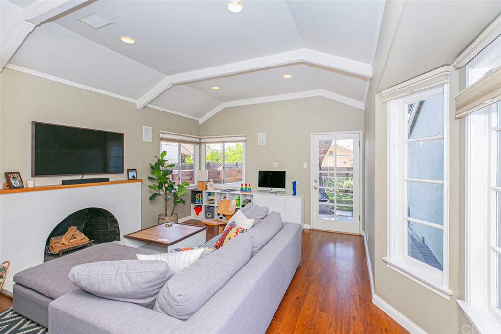 690 Arden Avenue Glendale, CA 91202 - Photo 45 of 70 a living room with furniture a flat screen tv and a fireplace