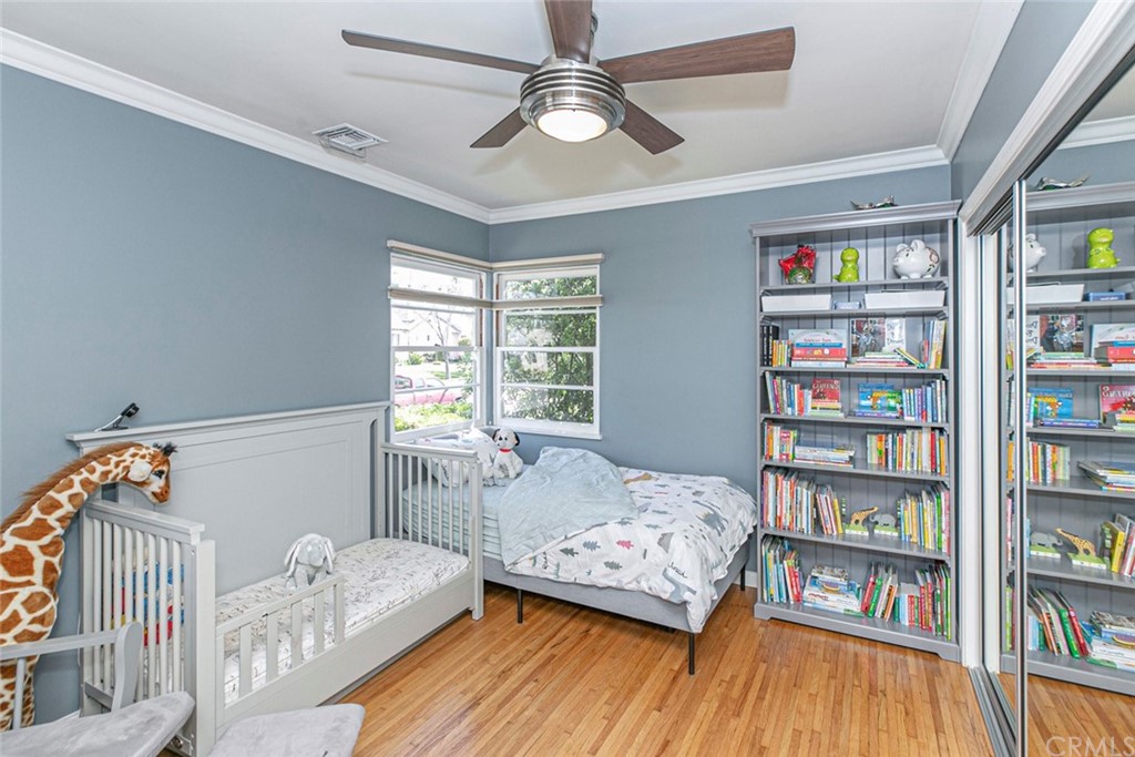 690 Arden Avenue Glendale, CA 91202 - Photo 48 of 70 a bedroom with furniture and a book shelf