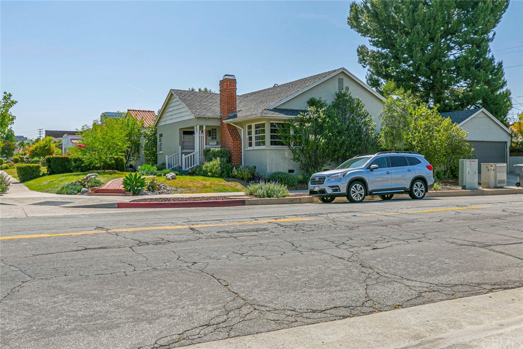 690 Arden Avenue Glendale, CA 91202 - Photo 5 of 70 a front view of a house with a yard and potted plants