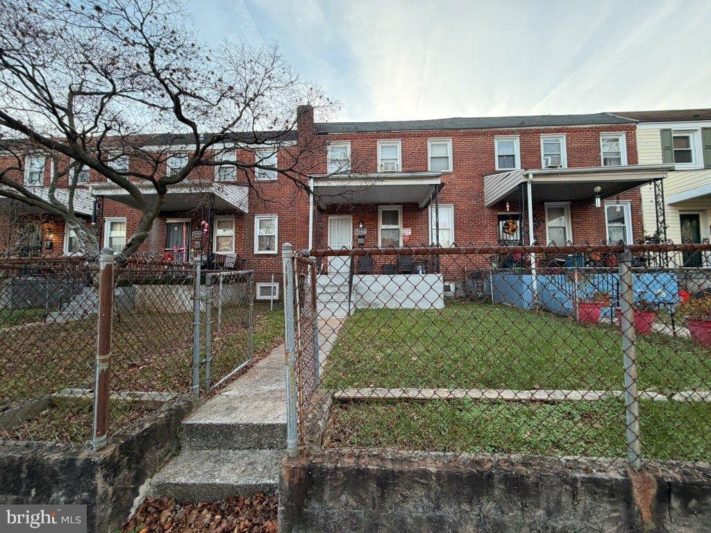 5356 Cuthbert Avenue Baltimore, MD 21215 - Photo 1 of 6 a front view of a house with garden