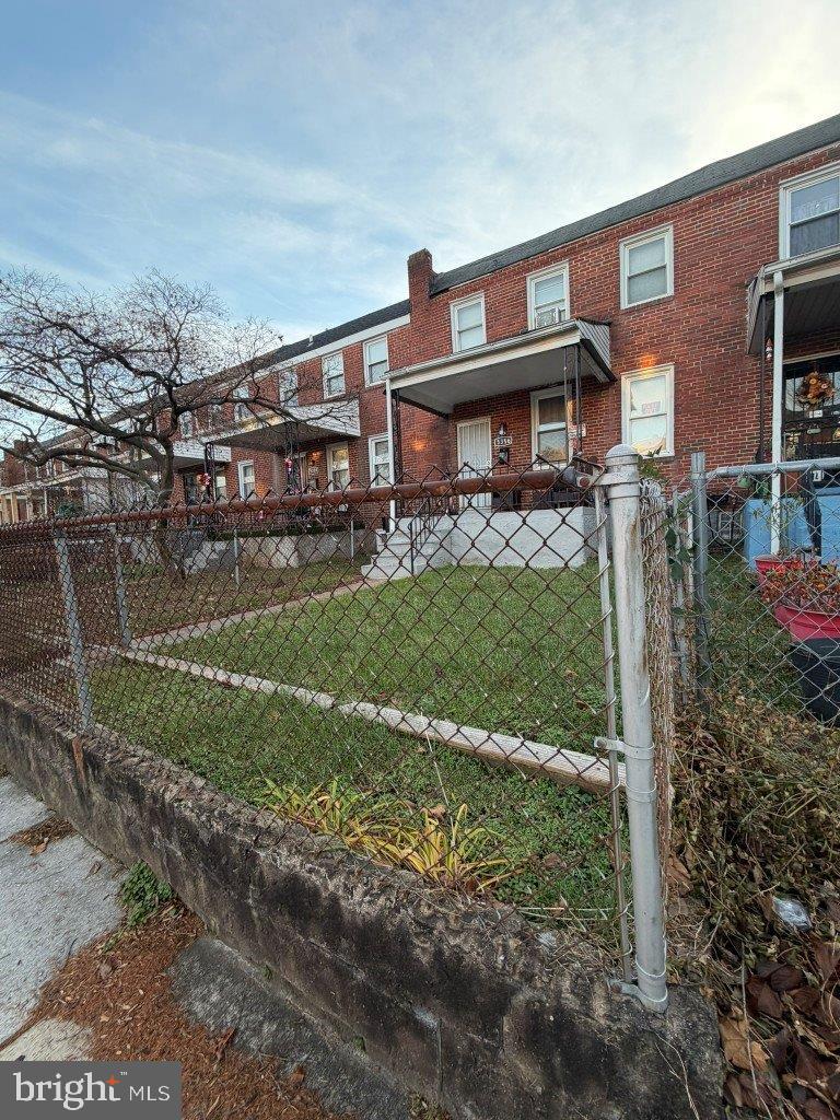 5356 Cuthbert Avenue Baltimore, MD 21215 - Photo 3 of 6 a front view of a house with garden