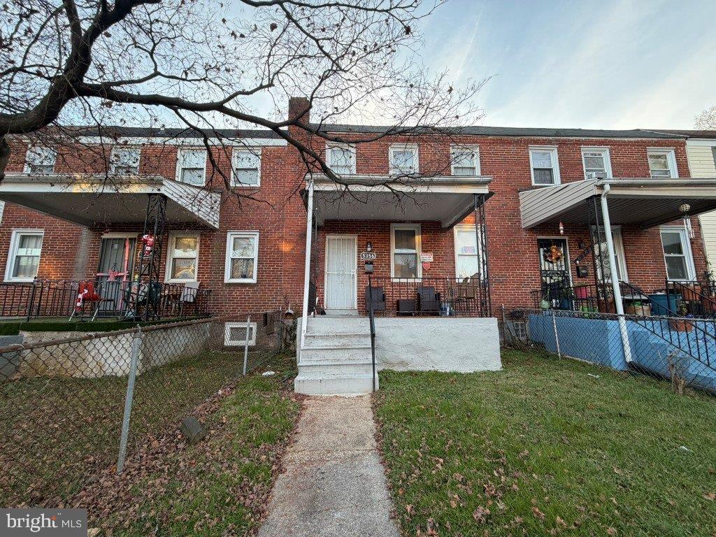 5356 Cuthbert Avenue Baltimore, MD 21215 - Photo 6 of 6 a front view of a house with a yard