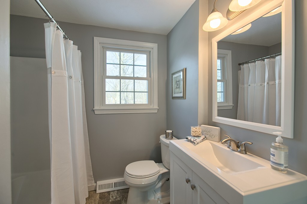 6 Campbell Road Billerica, MA 01821 - Photo 13 of 30 a bathroom with a sink toilet and mirror
