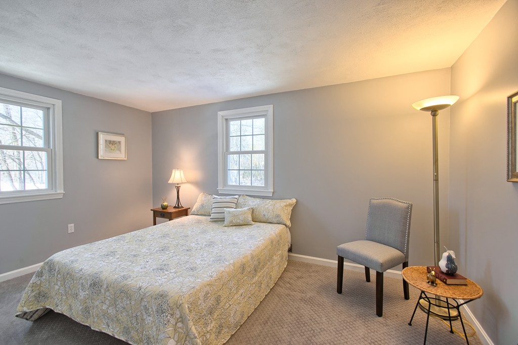 6 Campbell Road Billerica, MA 01821 - Photo 16 of 30 a bedroom with a bed and chair
