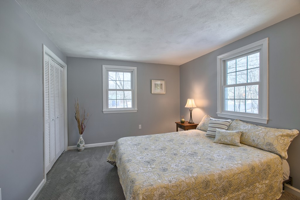 6 Campbell Road Billerica, MA 01821 - Photo 17 of 30 a bedroom with a bed and window