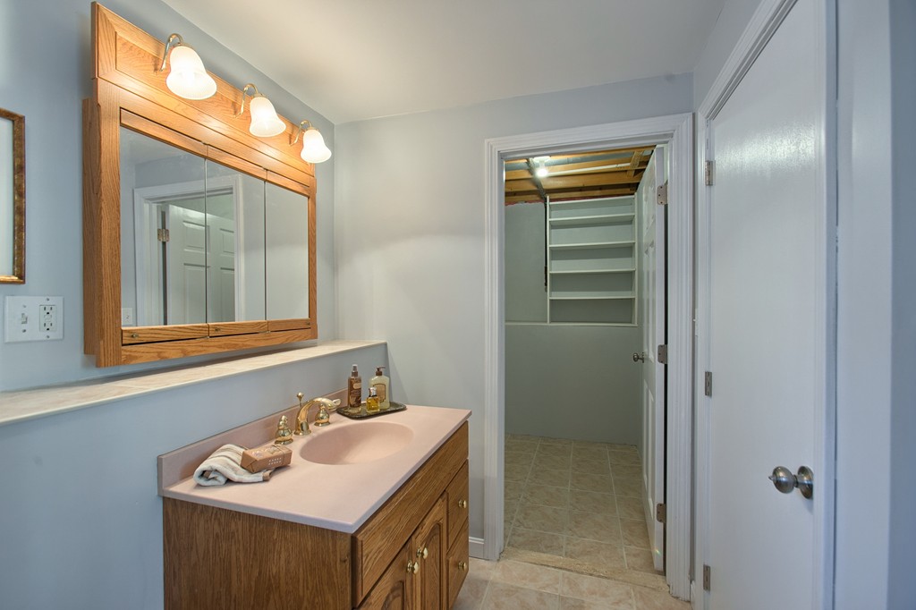 6 Campbell Road Billerica, MA 01821 - Photo 23 of 30 a bathroom with a sink a vanity and a mirror