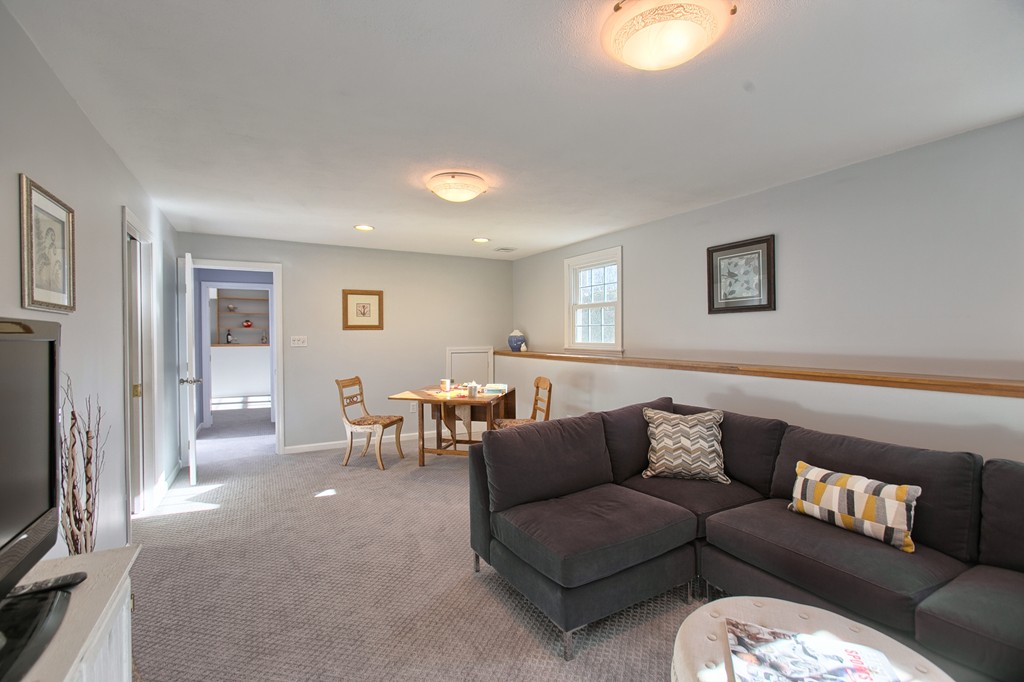 6 Campbell Road Billerica, MA 01821 - Photo 26 of 30 a living room with furniture and a flat screen tv