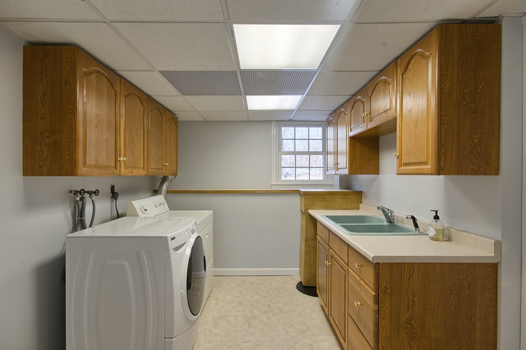 6 Campbell Road Billerica, MA 01821 - Photo 28 of 30 a utility room with sink dryer and washer