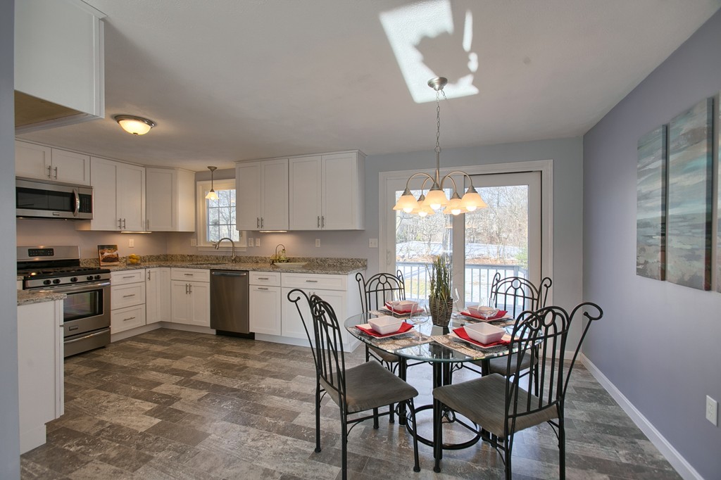 6 Campbell Road Billerica, MA 01821 - Photo 5 of 30 a kitchen with a dining table chairs stainless steel appliances and window