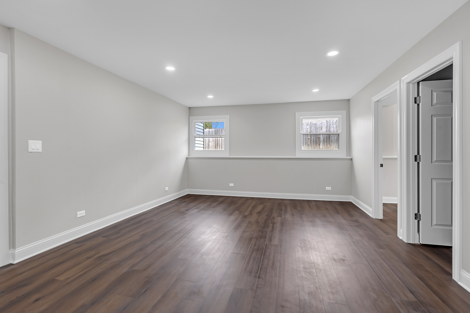 410 Kickapoo Avenue Batavia, IL 60510 - Photo 16 of 25 an empty room with wooden floor and windows