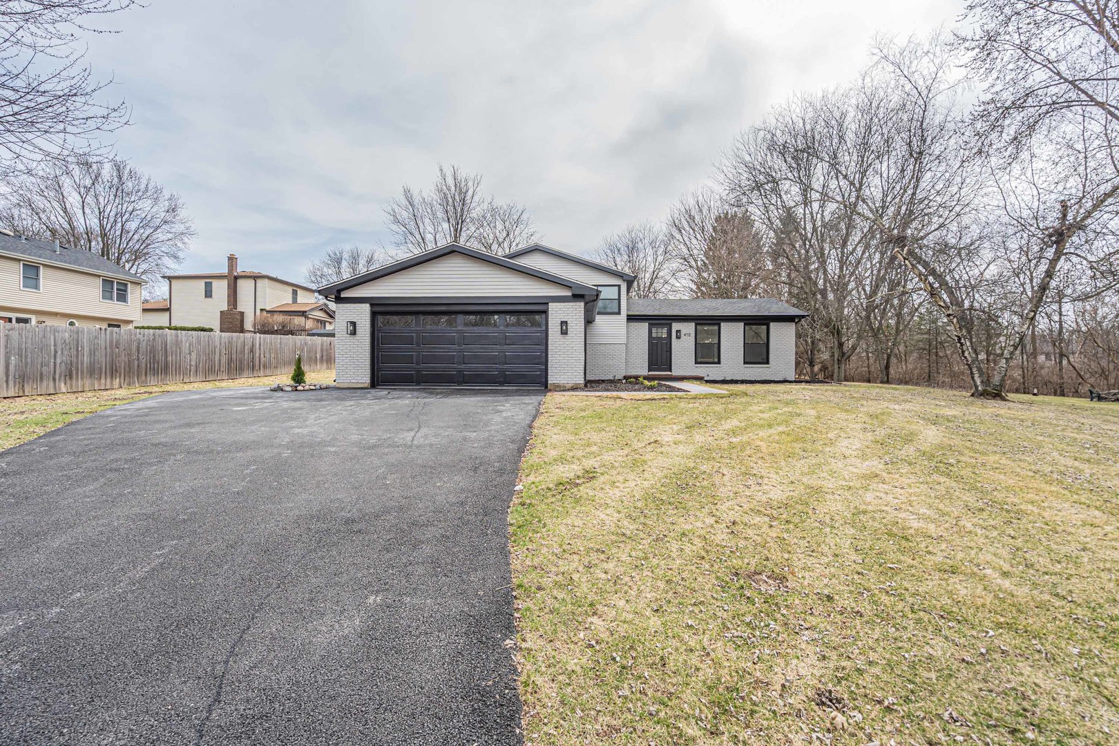 410 Kickapoo Avenue Batavia, IL 60510 - Photo 19 of 25 a view of a house with a yard and fence
