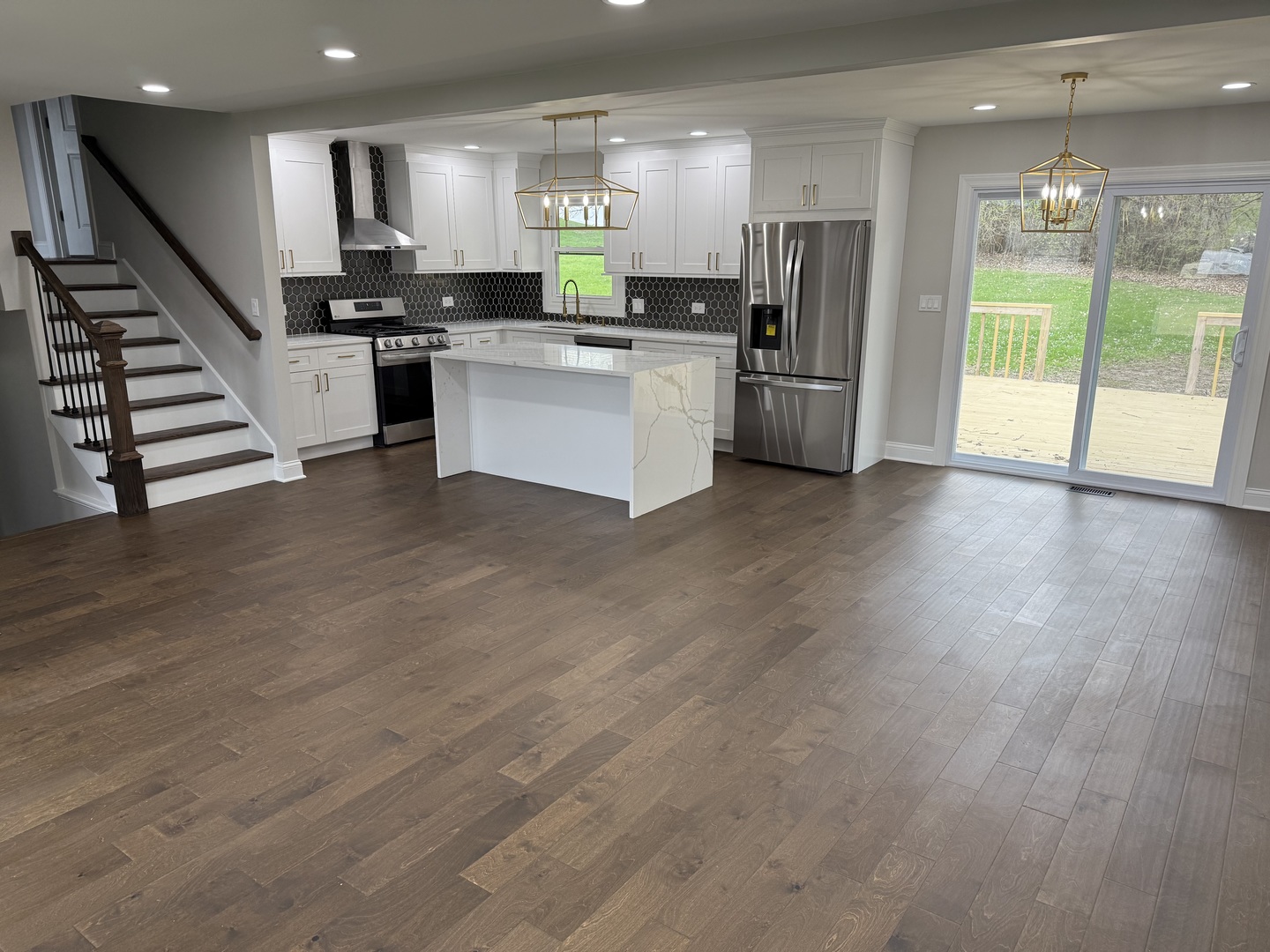 410 Kickapoo Avenue Batavia, IL 60510 - Photo 2 of 25 a view of a kitchen with refrigerator stove and wooden floor