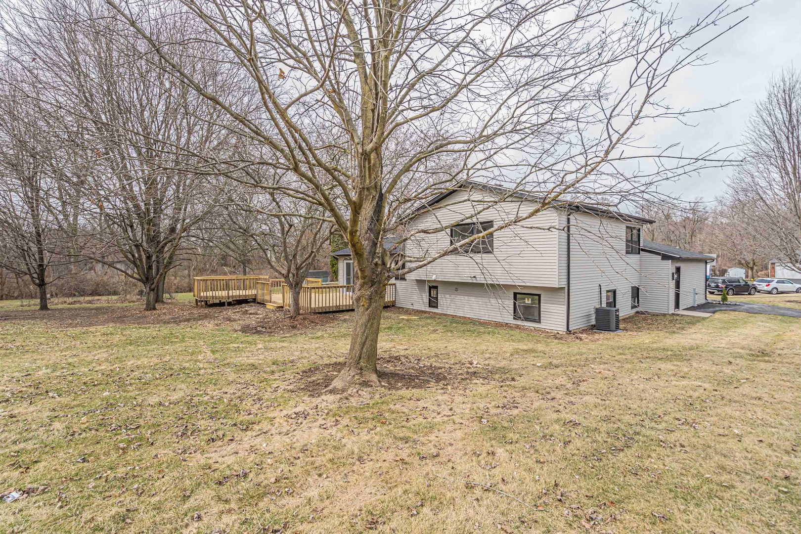 410 Kickapoo Avenue Batavia, IL 60510 - Photo 25 of 25 a white house that has a tree in front of it