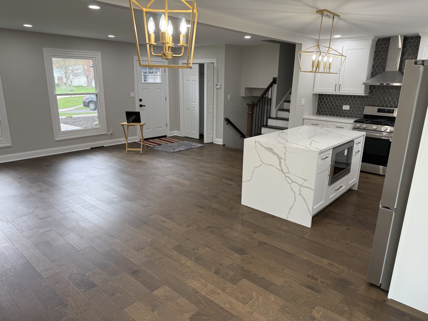 410 Kickapoo Avenue Batavia, IL 60510 - Photo 4 of 25 a view of kitchen and hall with wooden floor