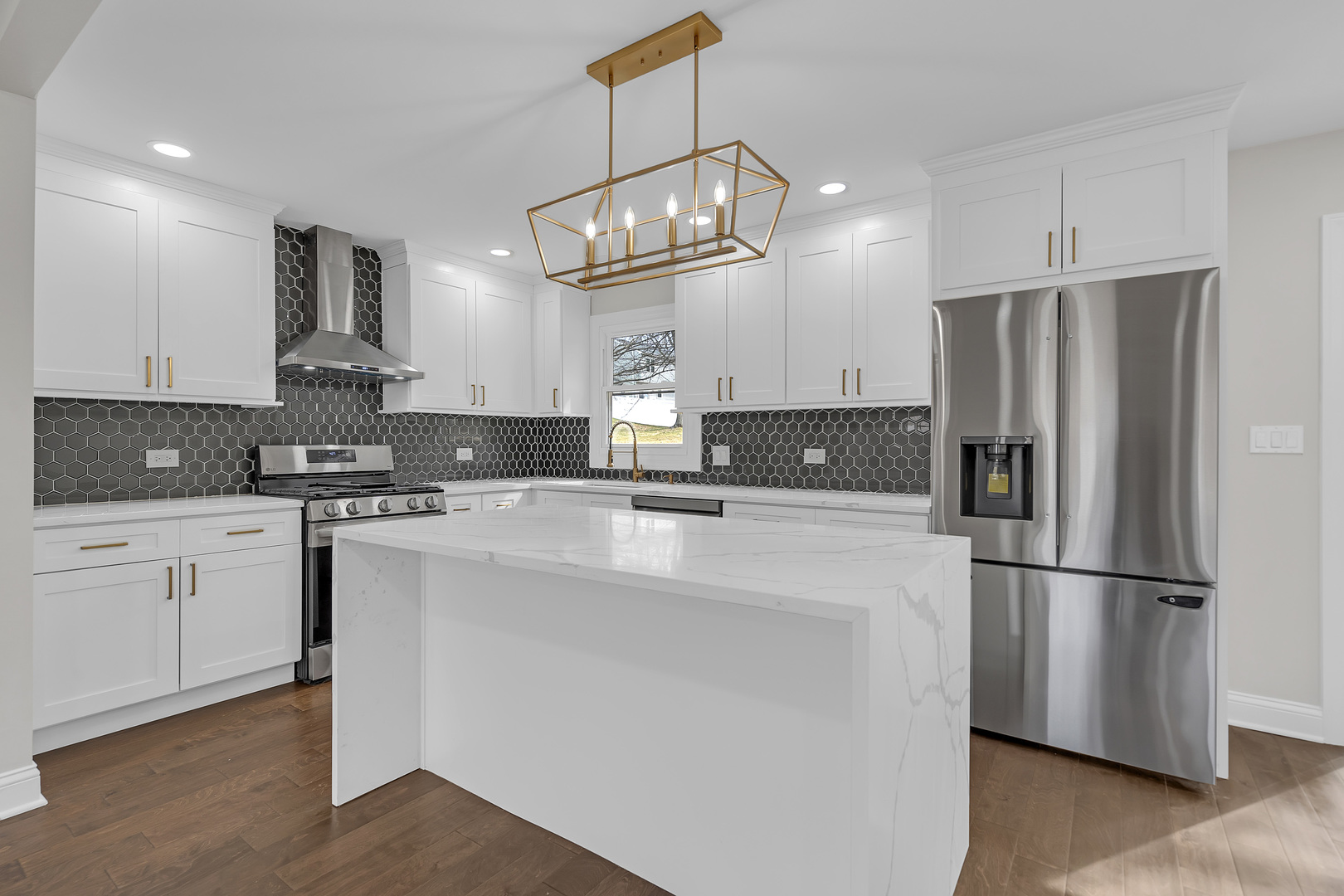 410 Kickapoo Avenue Batavia, IL 60510 - Photo 6 of 25 a kitchen with stainless steel appliances granite countertop a refrigerator a stove a sink and a refrigerator