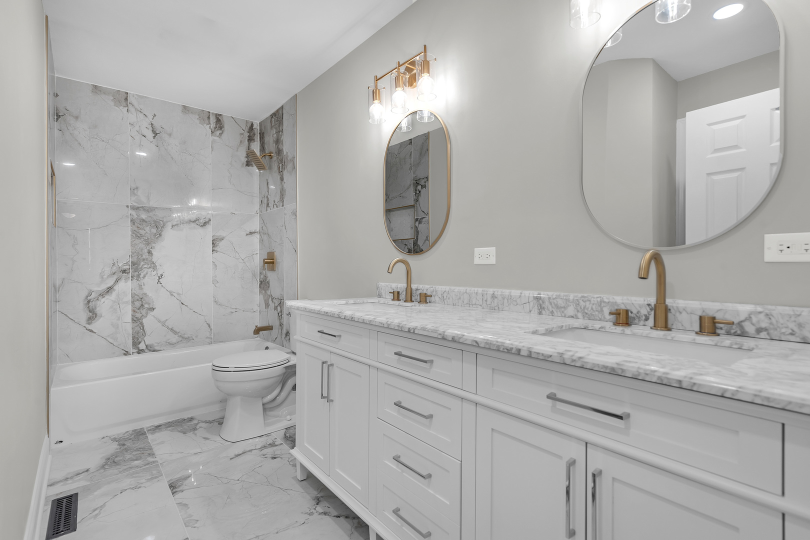 410 Kickapoo Avenue Batavia, IL 60510 - Photo 7 of 25 a bathroom with a granite countertop toilet a sink and a mirror