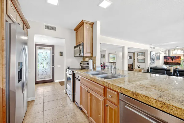 a kitchen with a dining table chairs and utility room