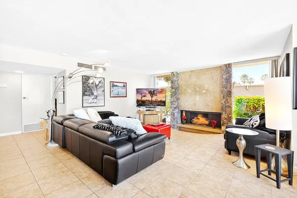 a living room with furniture and a large window