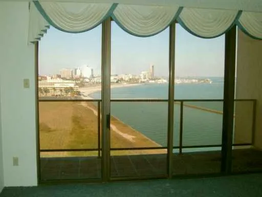 a bathroom with a glass door shower and a bathtub