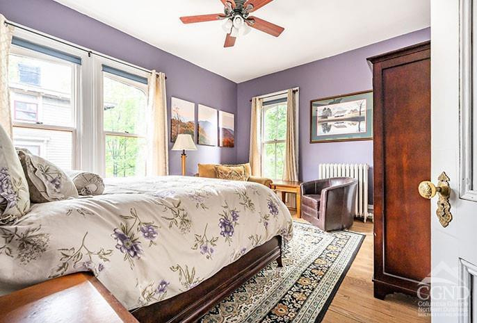 5 Willard Place Hudson, NY 12534 - Photo 11 of 26 a bedroom with a bed wooden floor and a table