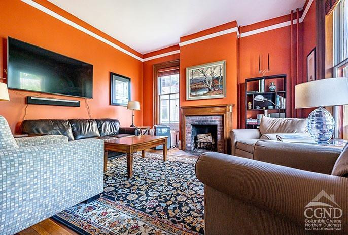 5 Willard Place Hudson, NY 12534 - Photo 5 of 26 a living room with a couch and a flat screen tv